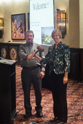 Marty Risch (left), former chair of the NADP Executive Committee, passing the gavel to Donna Schwede, the new chair of the Executive Committee.